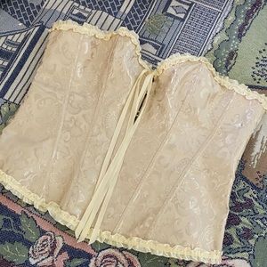beige corset with ruffle trimming